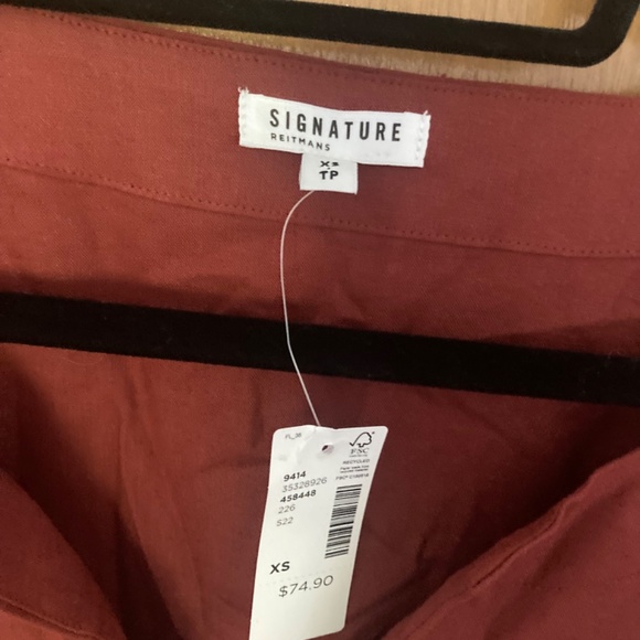 Reitman’s signature red dress - Picture 2 of 3